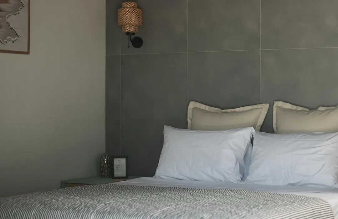 Calm bedroom corner with linen bedding